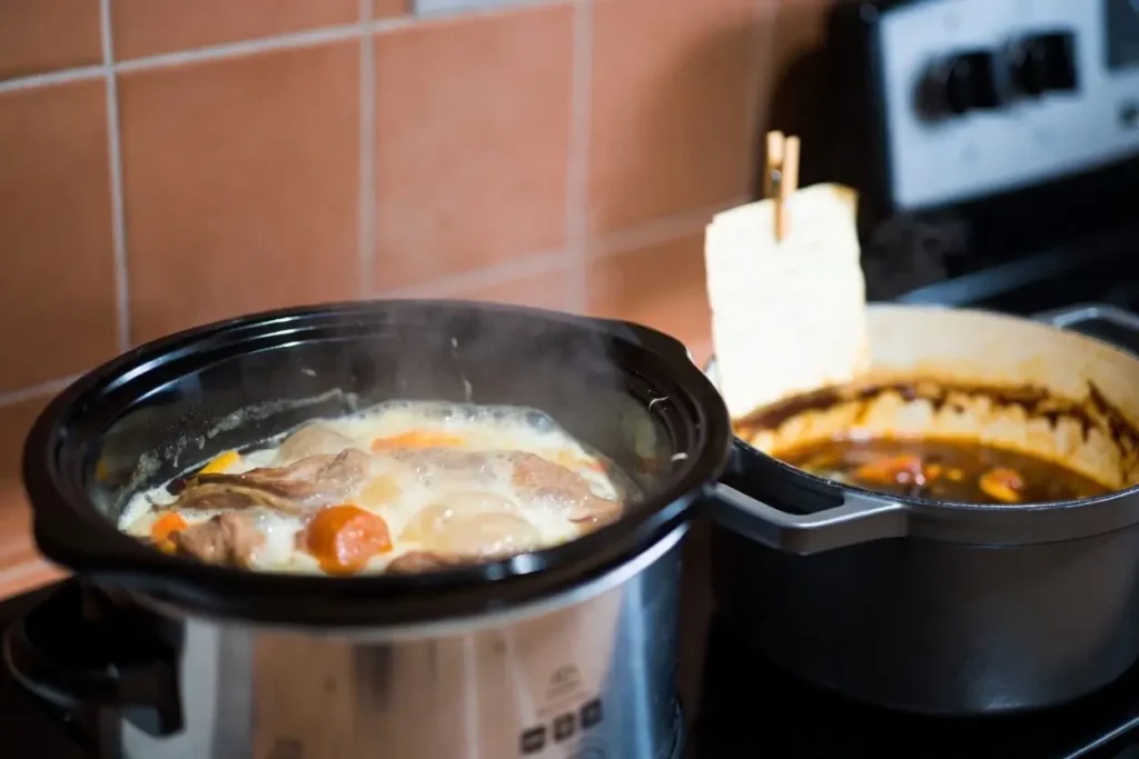 Slow cooker and Dutch oven with moroccan lamb stew for easy slow cooker recipe hack