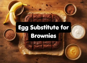 Egg substitute for brownies including Greek yogurt, flax seed, banana, and applesauce displayed next to freshly baked chocolate brownie squares
