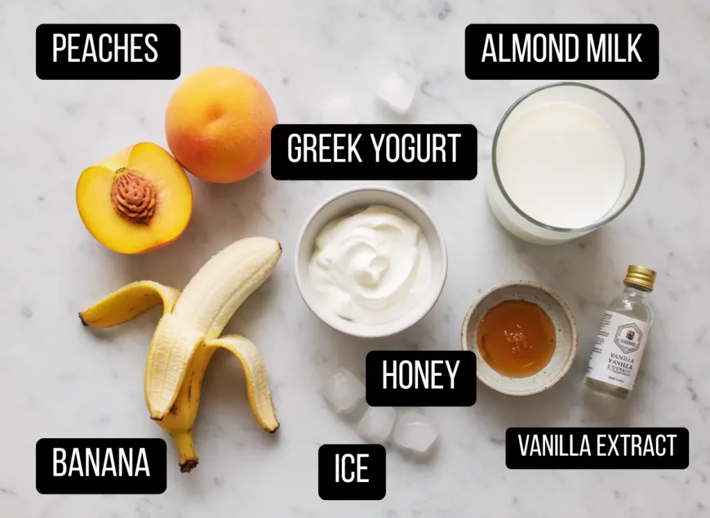Peach Smoothie Recipe – Fresh, Creamy & Ready in 5 Minutes 2 Flat lay of fresh ingredients for a healthy peach smoothie recipe including peaches, banana, and Greek yogurt