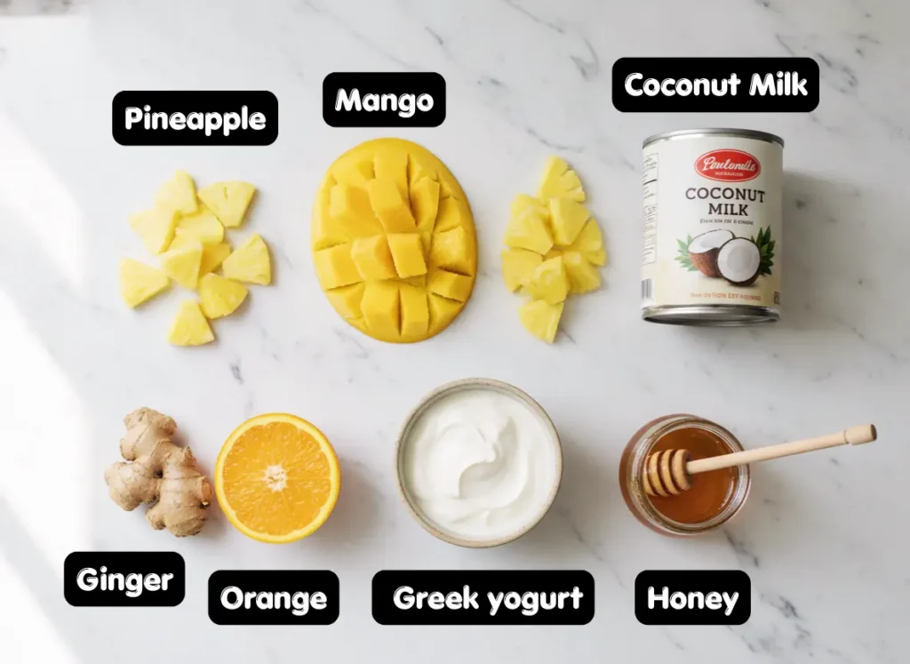 Mango Pineapple Smoothie Recipe – Thick, Tropical & Ready in 5 Minutes 2 Fresh ingredients for mango pineapple smoothie recipe including frozen mango, pineapple, coconut milk, Greek yogurt and orange juice