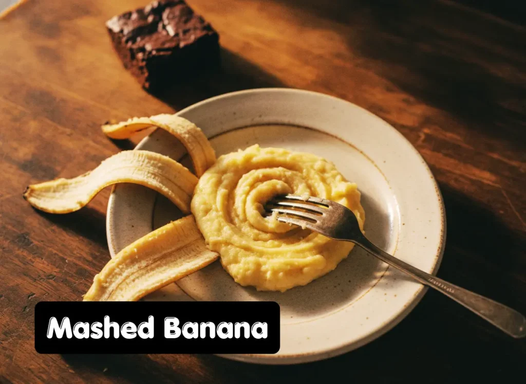 Mashed ripe banana on a plate used as a natural egg substitute for brownies